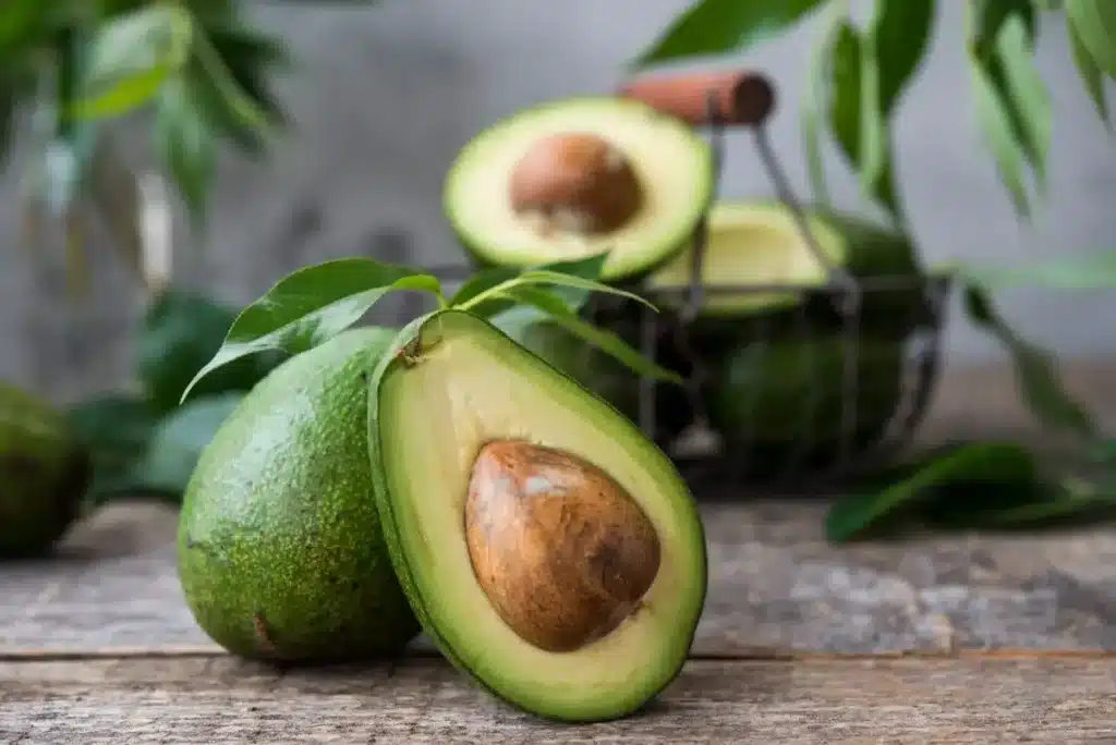 Close Up Image of a Sliced Avocado on a Wooden Table