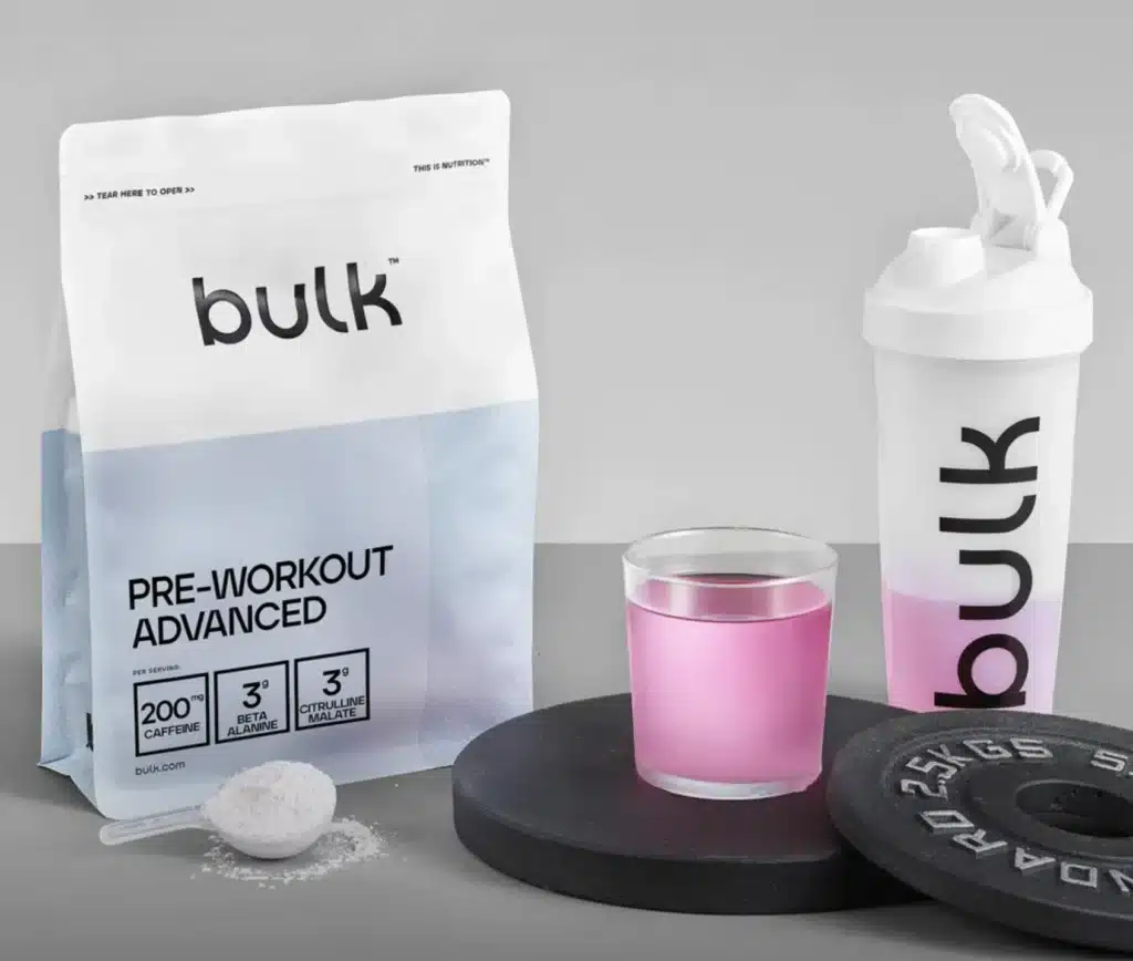 Screenshot of Bulk Pre-Workout ADVANCED Beside a Glass & Protein Shaker