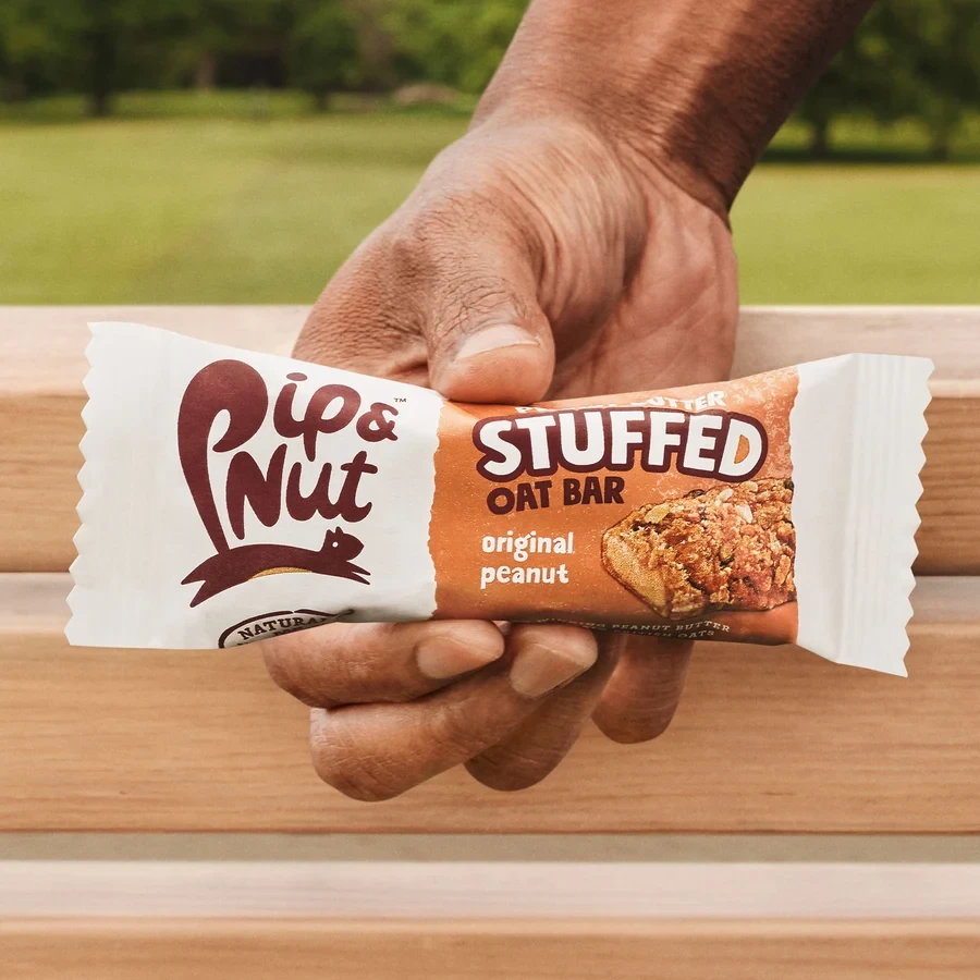 Screenshot Showing Someone Holding a Pip & Nut Stuffed Oat Cereal Bar